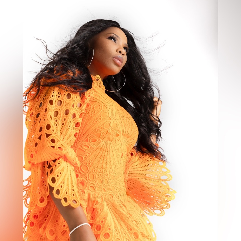 Long sleeve orange dress.